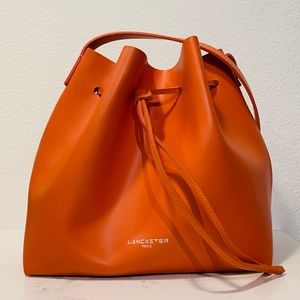 Lancaster Paris orange bucket bag